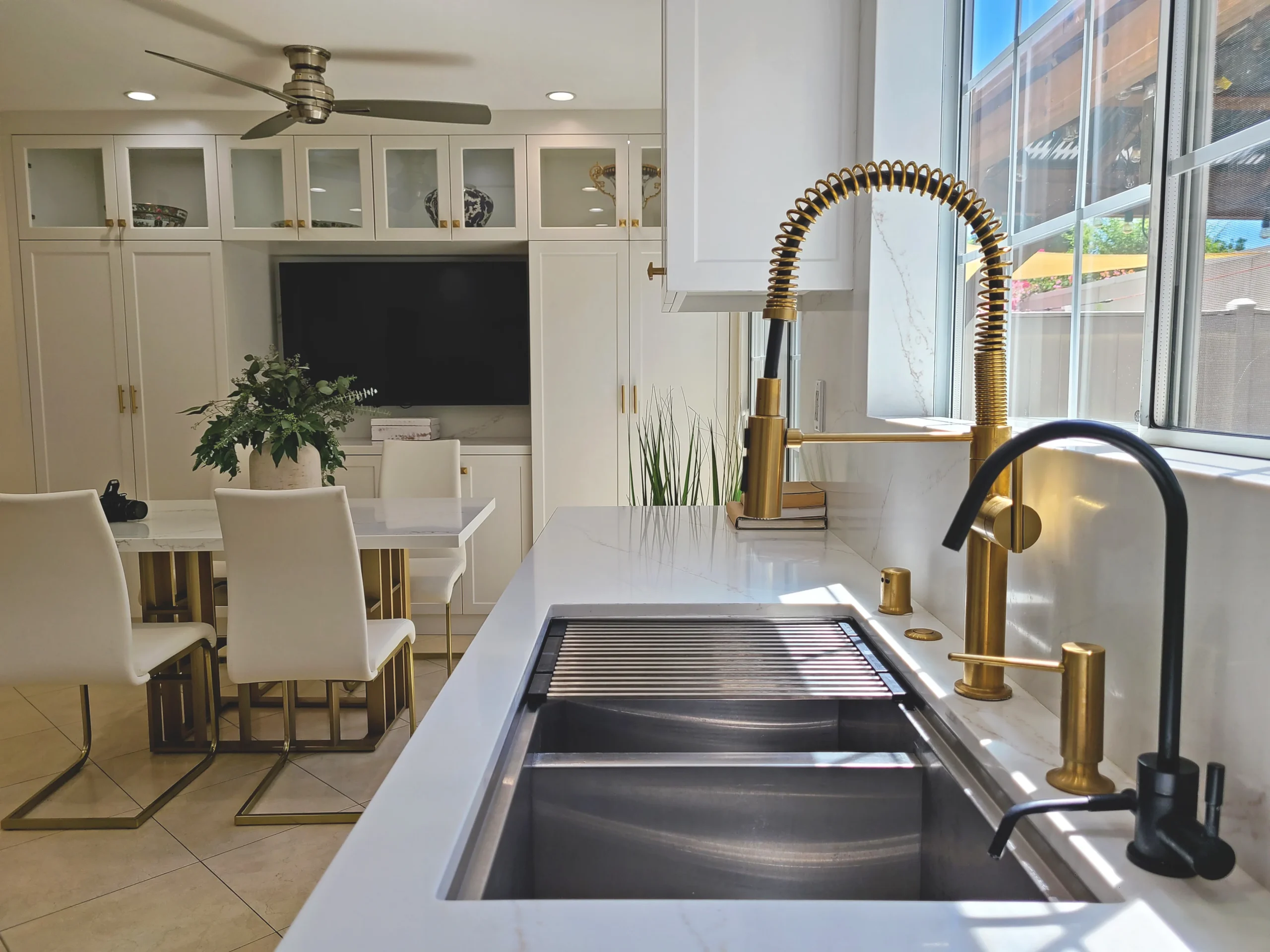 Open Kitchen Dining Workstation Sink Brass Faucet in Tarzana, CA by Interior Conception